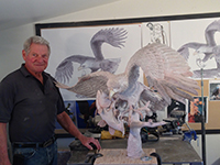 Miles Tucker with 'The Eagle Has Landed' bronze sculpture nearing completion.