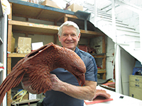 Miles Tucker proudly displaying the wax rendition of the eagle's upper body on 'The Eagle Has Landed' bronze sculpture.